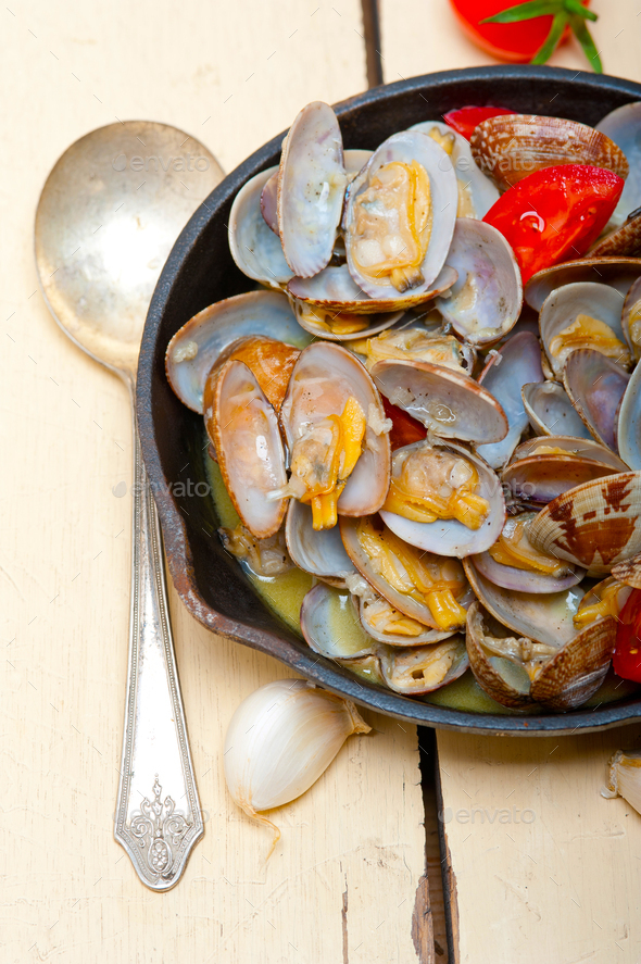 fresh clams on an iron skillet Stock Photo by keko64 PhotoDune